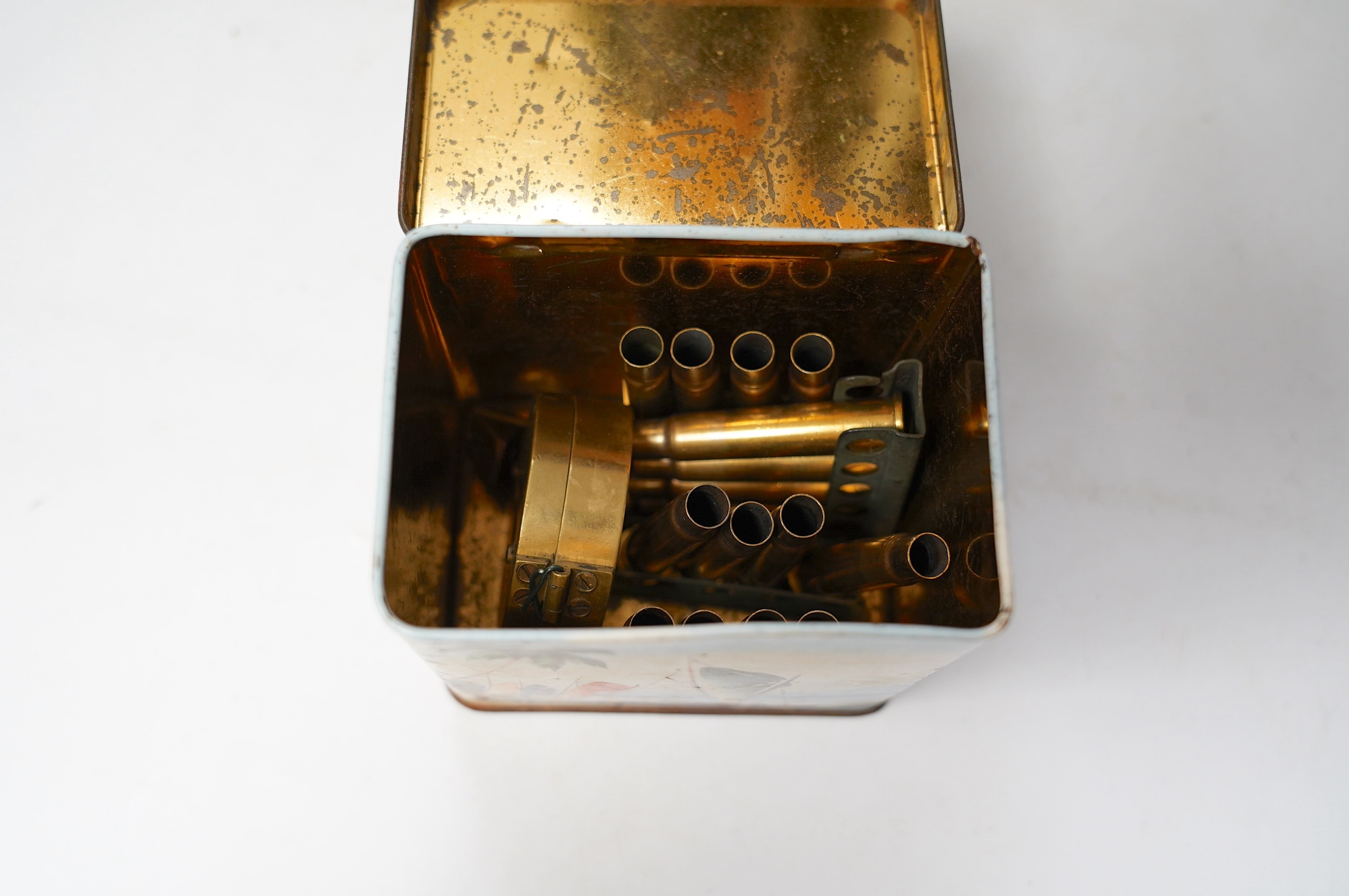 A collection of militaria and WWII related items including; three 1940s copies of the Daily Express with articles related to key events including Dunkirk, a knife in a leather scabbard, a number of photos, an aviation ca
